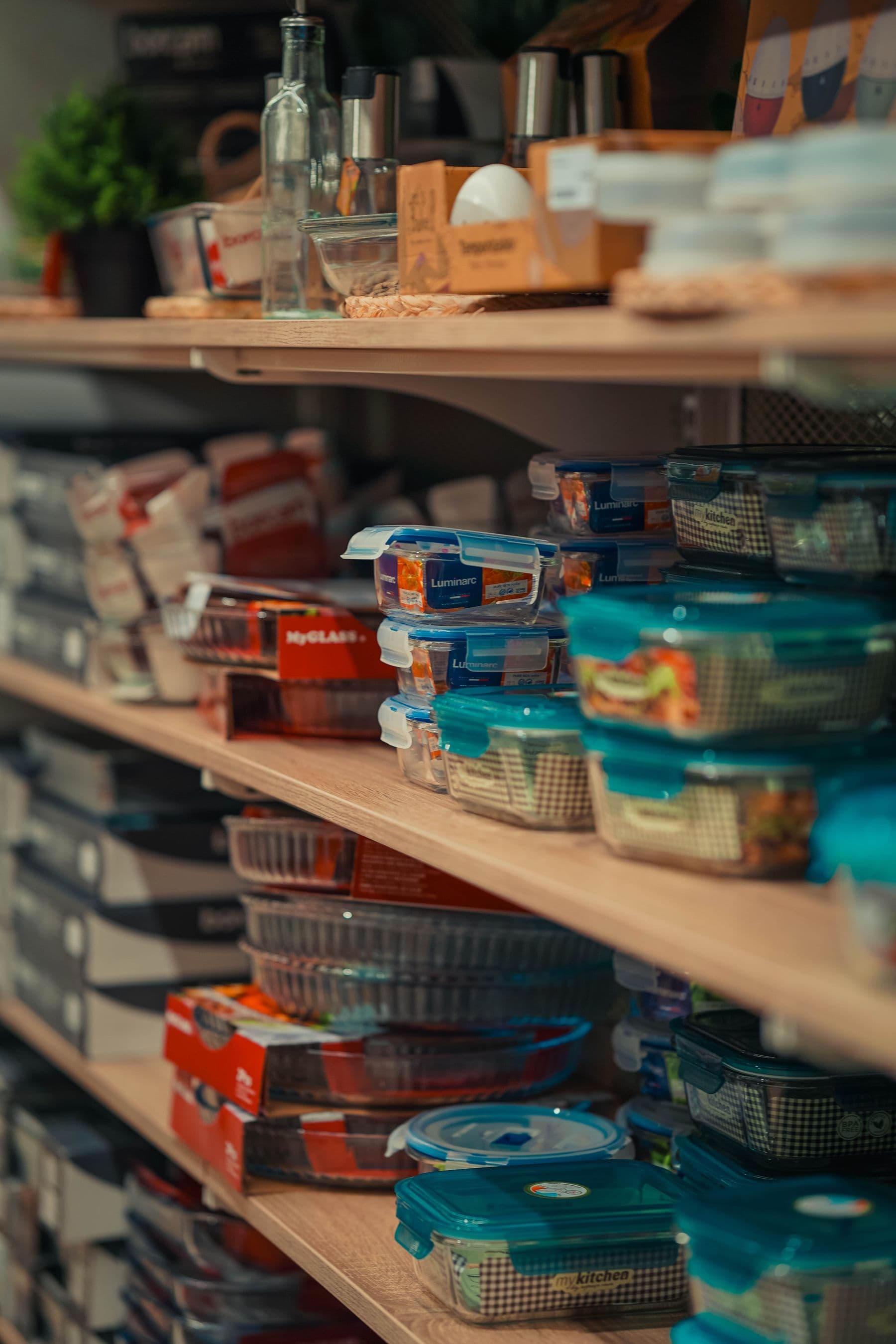 A warm, neatly organized pantry with jars and containers